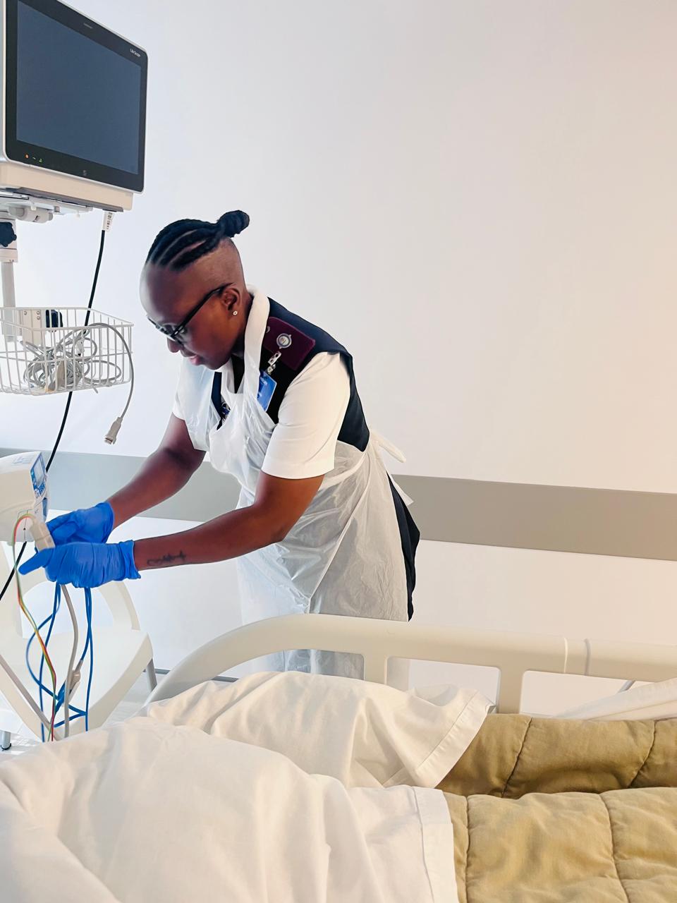 Path-Clinic practitioner caring for a patient in hospital